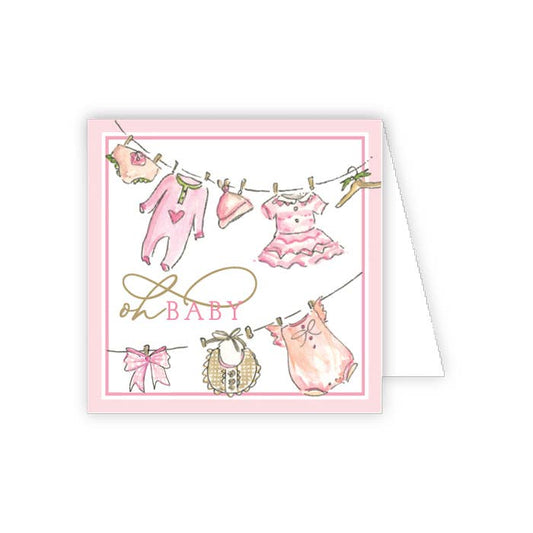 Greeting card with baby clothes on a line and 'Oh Baby' printed in the center