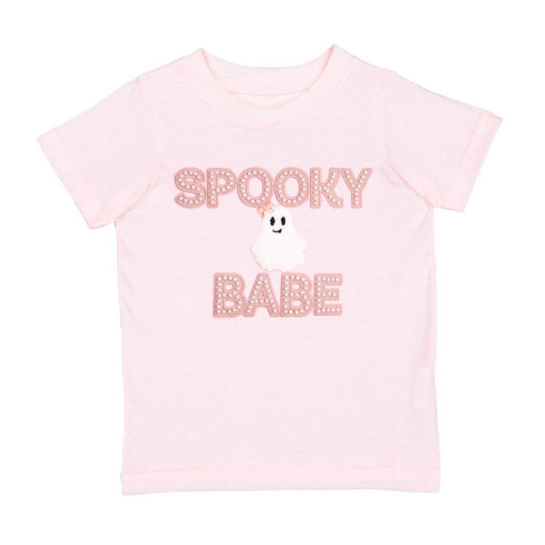 Pink t-shirt with 'Spooky Babe' text and ghost graphic on a white background
