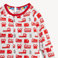 A close-up of a baby long-sleeve top with a white base and an all-over print of red fire trucks and gray fire stations, featuring a red ribbed collar.