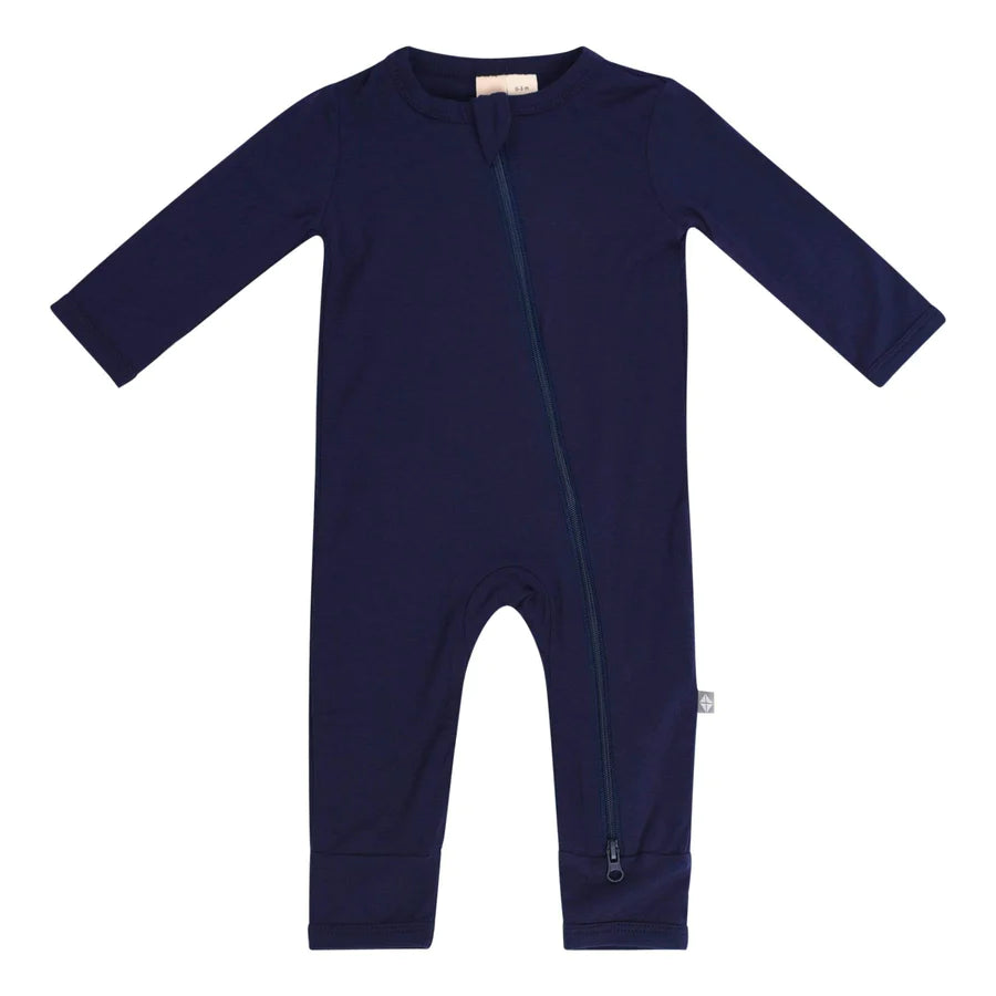 A navy-colored baby romper with long sleeves and dual zippers, made from bamboo rayon fabric.