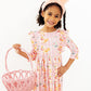 Plaid pink ruffle dress with ducklings