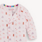 A light pink long-sleeve baby sleep sack with an all-over animal print of bears, elephants, and lions in soft pastel colors. It features a colorful striped inner collar and a visible 'magnetic mic' brand label inside the neckline.