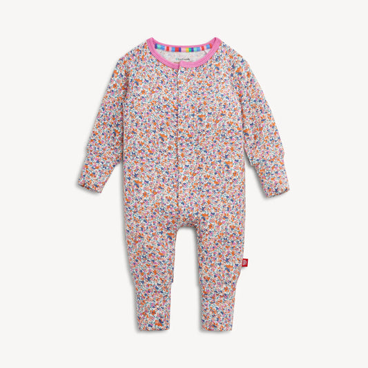 Floral-patterned baby onesie with colorful trim on a white background