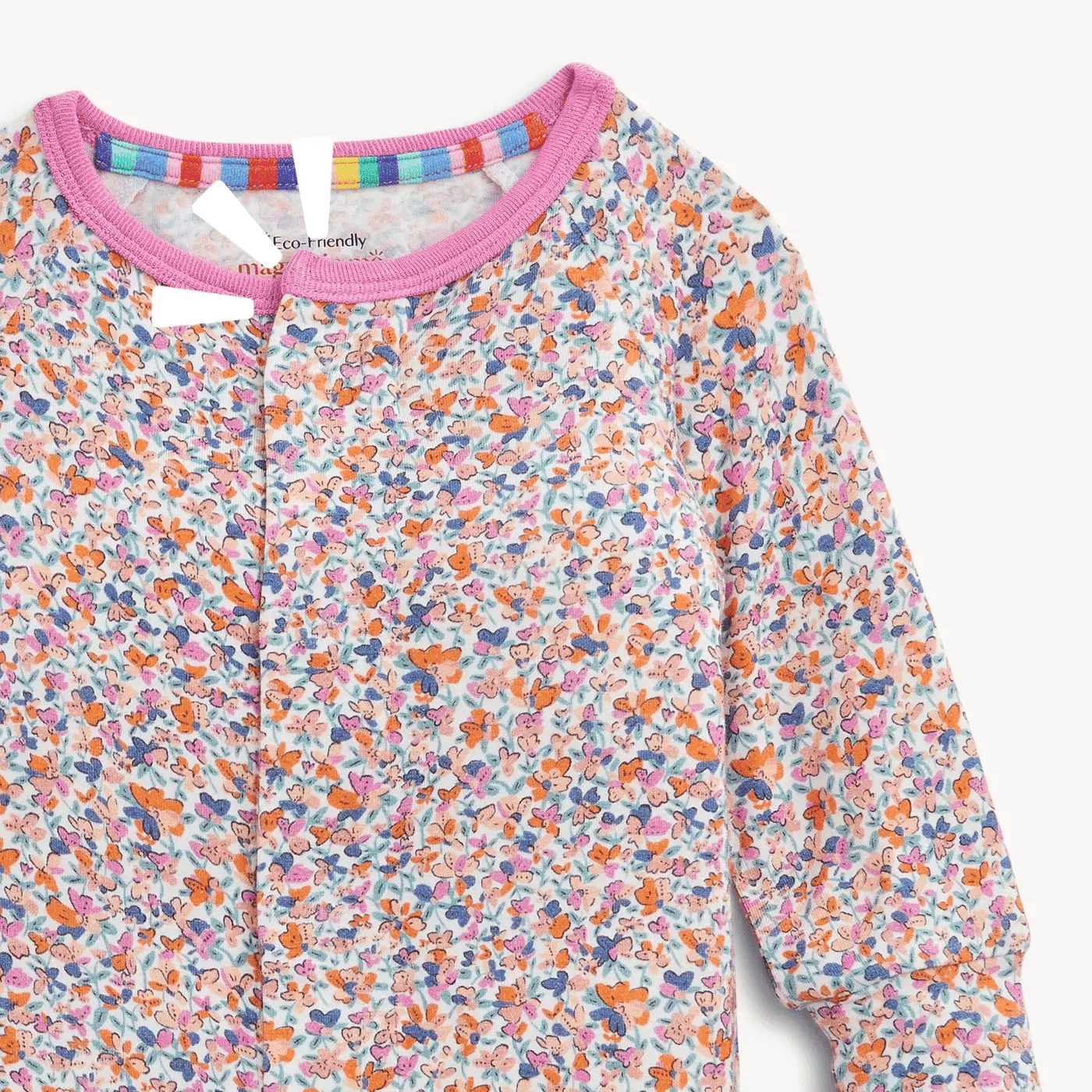 A close-up of a long-sleeve children's top with a dense multicolor butterfly print on a white base, featuring a pink ribbed collar and a colorful striped inner neck trim.