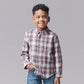 Long-sleeve plaid shirt with red, green, and white stripes over a white base, paired with blue jeans, against a solid gray background.