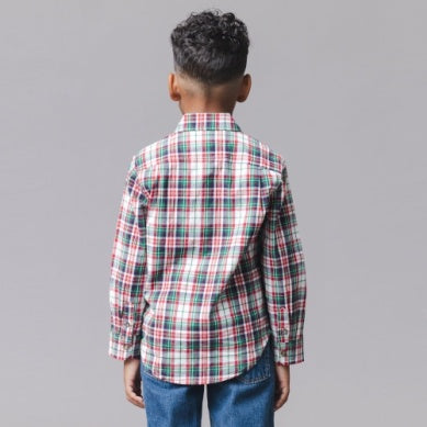 Long-sleeve plaid shirt with red, green, and white stripes over a white base, paired with blue jeans, against a solid gray background.