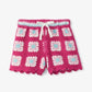 Pink crochet shorts with white and blue flowers 
