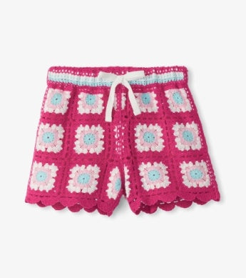 Pink crochet shorts with white and blue flowers 