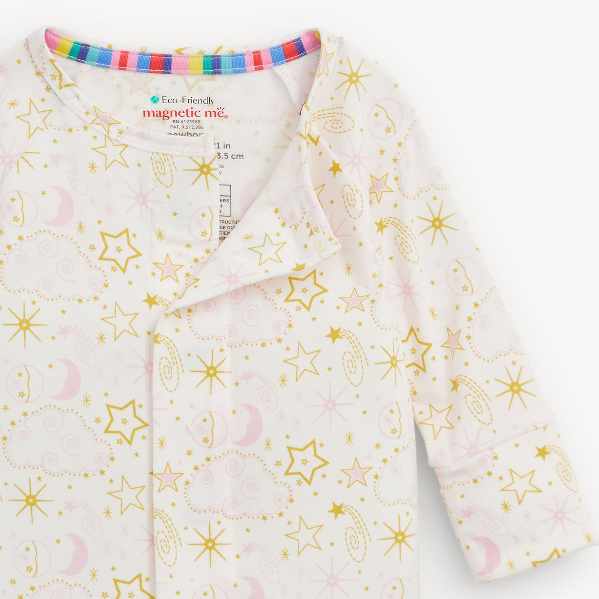 Baby onesie with star and moon pattern on a white background