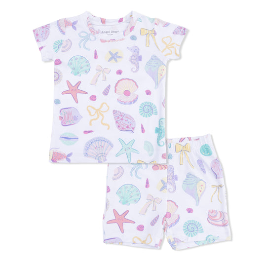 Children's pajama set with sea-themed pattern on a white background