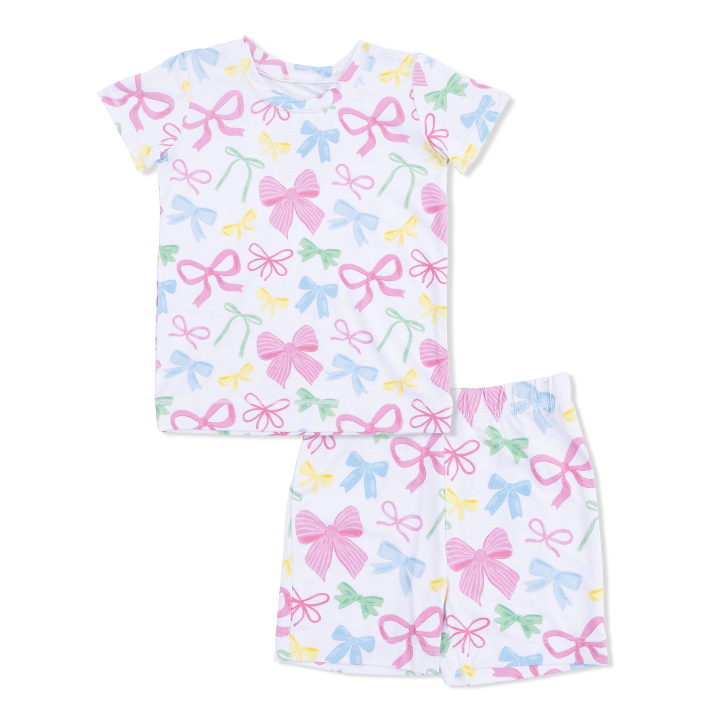 Children's pajama set with bow pattern on a white background