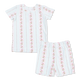 White children's pajamas with red floral on a white background