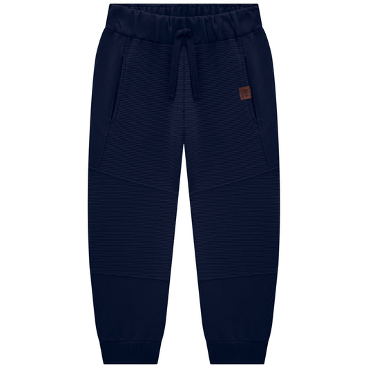 Navy blue jogger pants with a brown patch