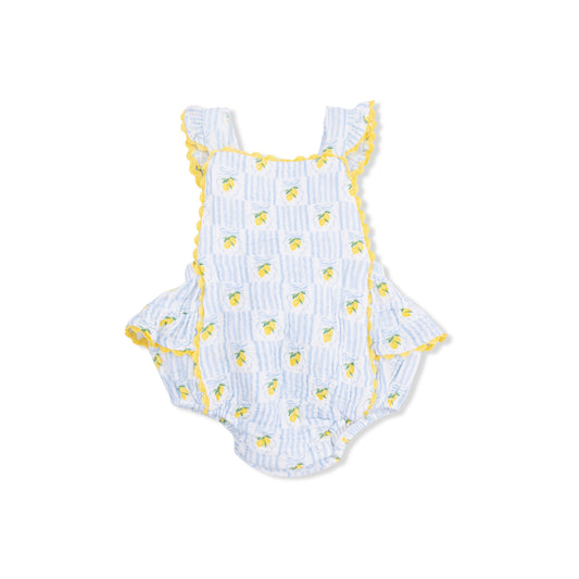 White baby romper with yellow lemon pattern on a white background