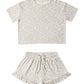 Floral-patterned crop top and shorts set on a white background