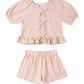 Pink checkered top and shorts set on a white background