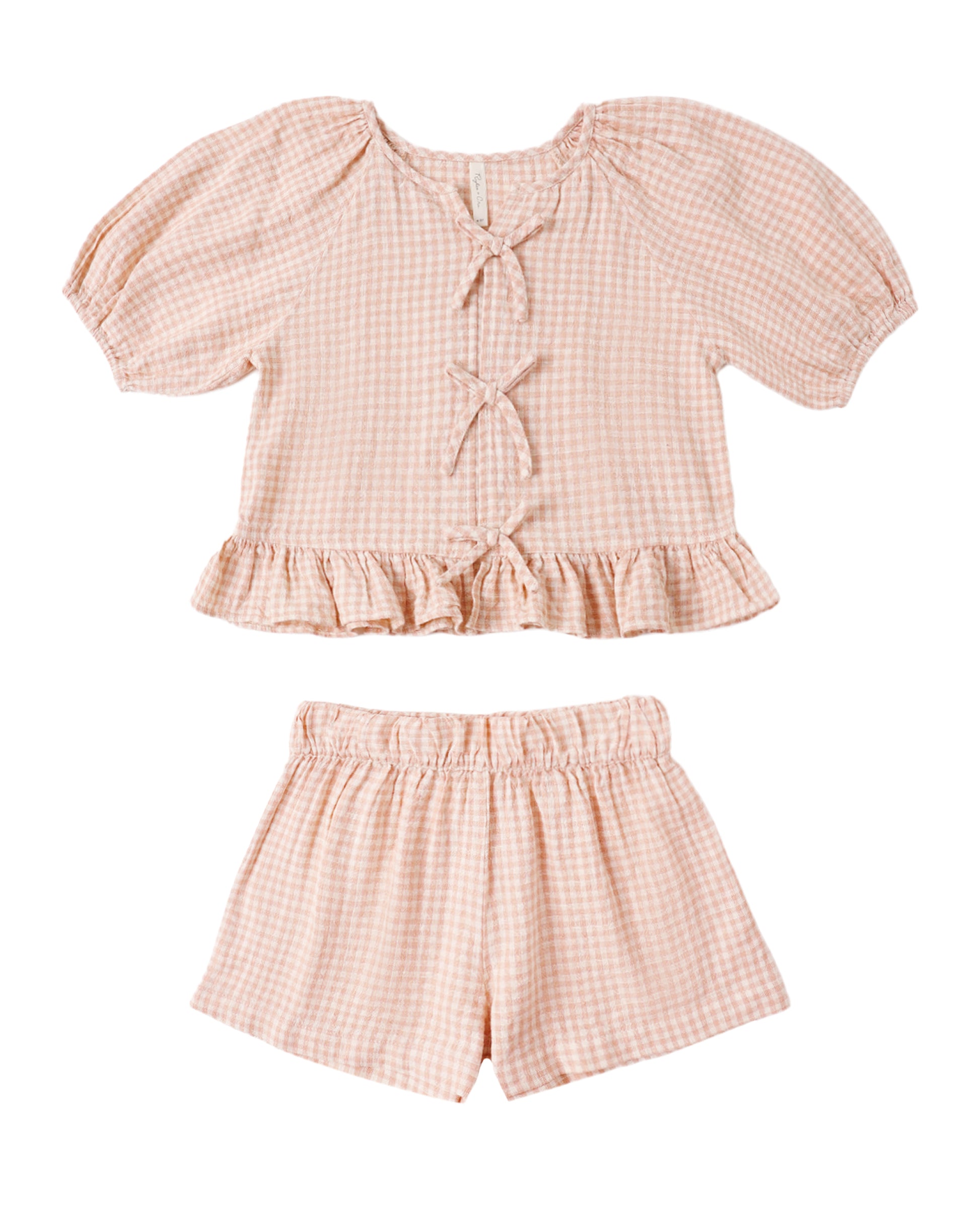 Pink checkered top and shorts set on a white background